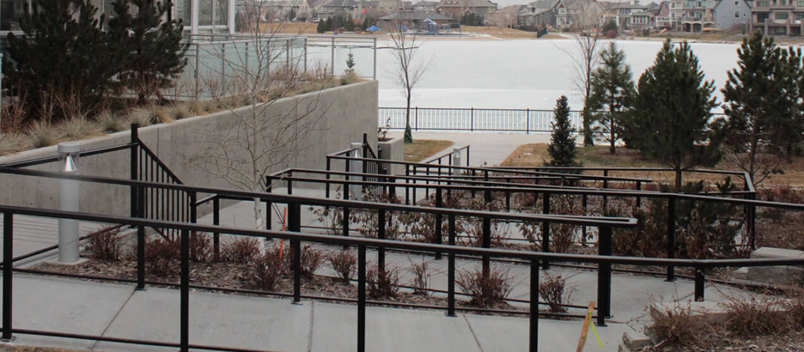 Storefront and Commercial Entrance Accessibility: Combining Ramp and Stair Railings to Meet Code on One Approach